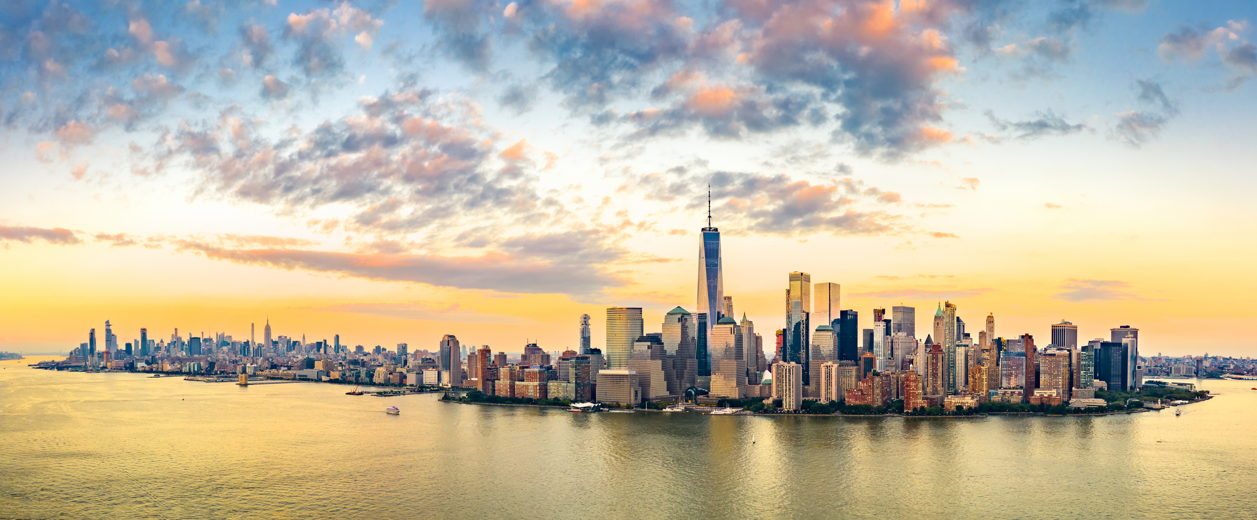 Aerial panorama of New York City skyline at sunset